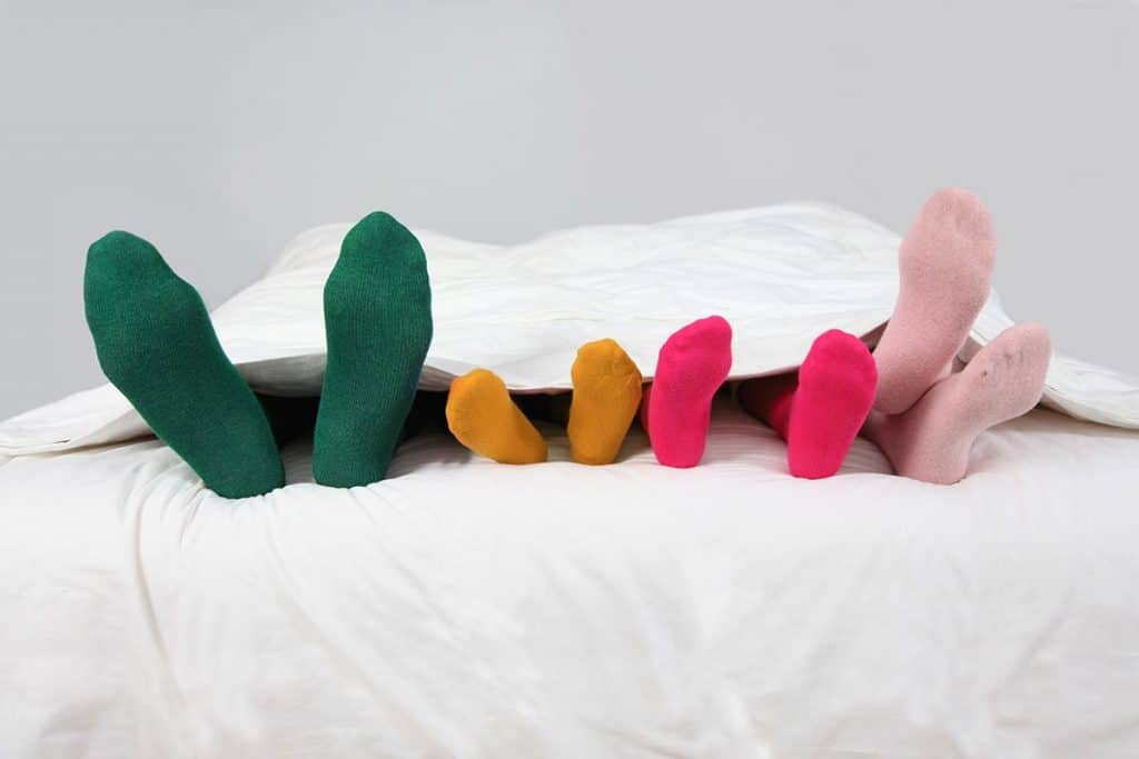 Family Sleeping with Socks on