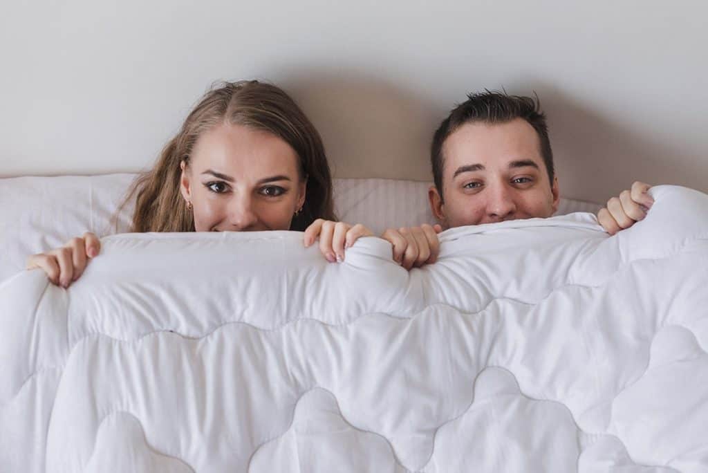 Couple Under Comforter