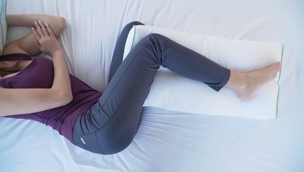 Girl Sleeping with Pillow Between Legs
