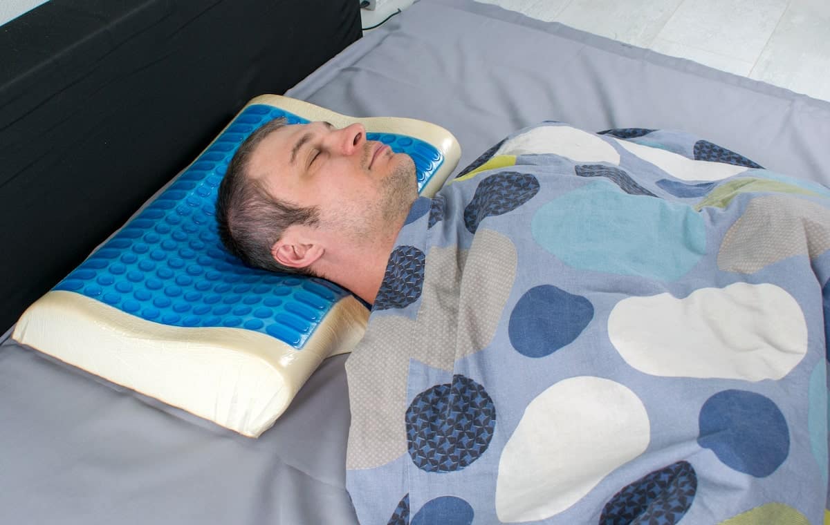 man sleeping on a cooling pillow