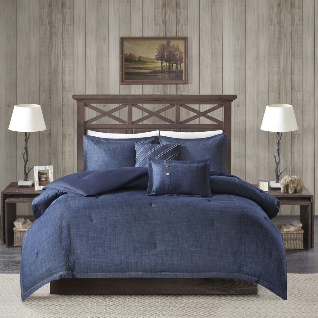 blue denim comforter on neat bed