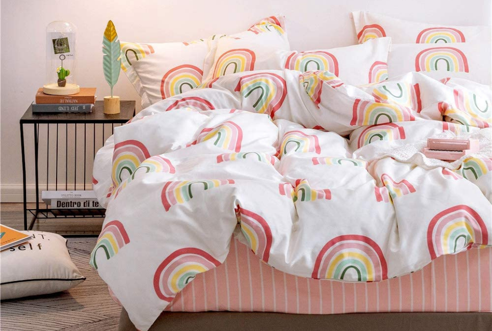 rainbow comforter in colorful bedroom