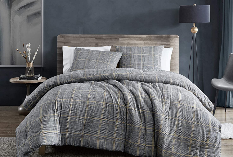 grey flannel comforter on bed