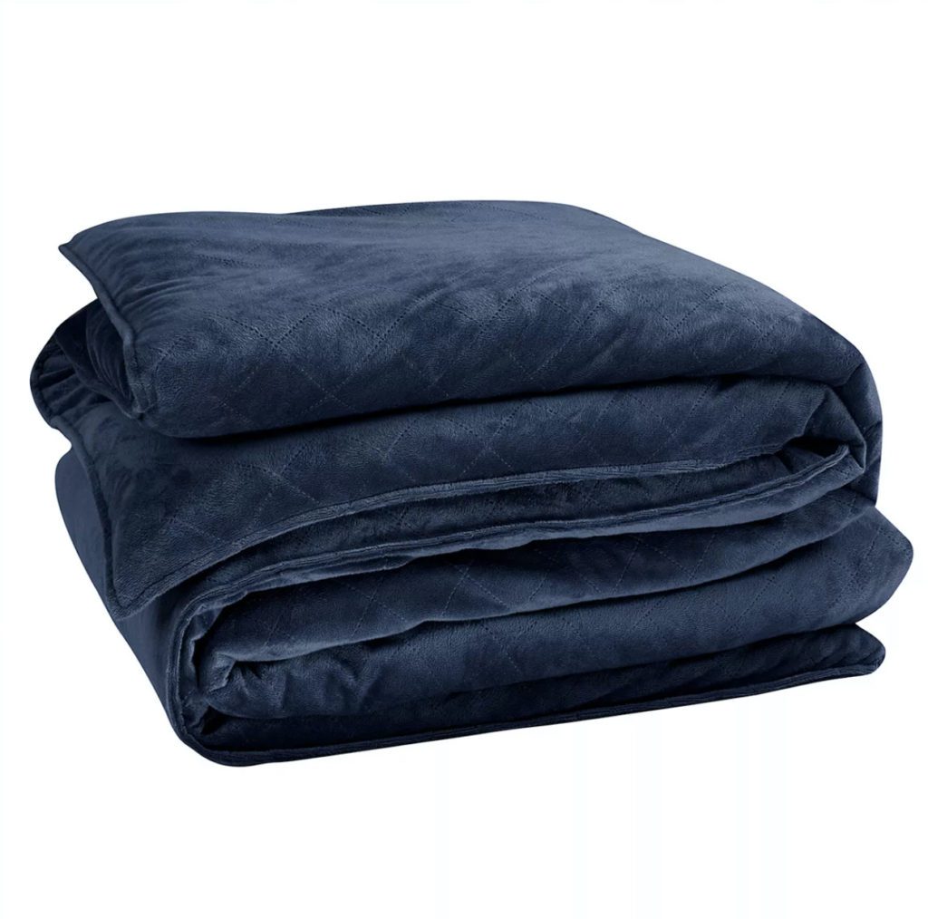 neatly folded navy soft weighted blanket