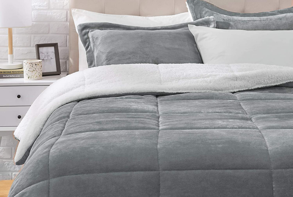 sherpa and grey microfiber comforter on bed