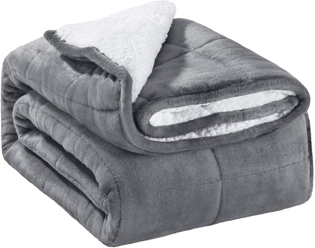 sherpa and grey velvet reversible blanket neatly folded