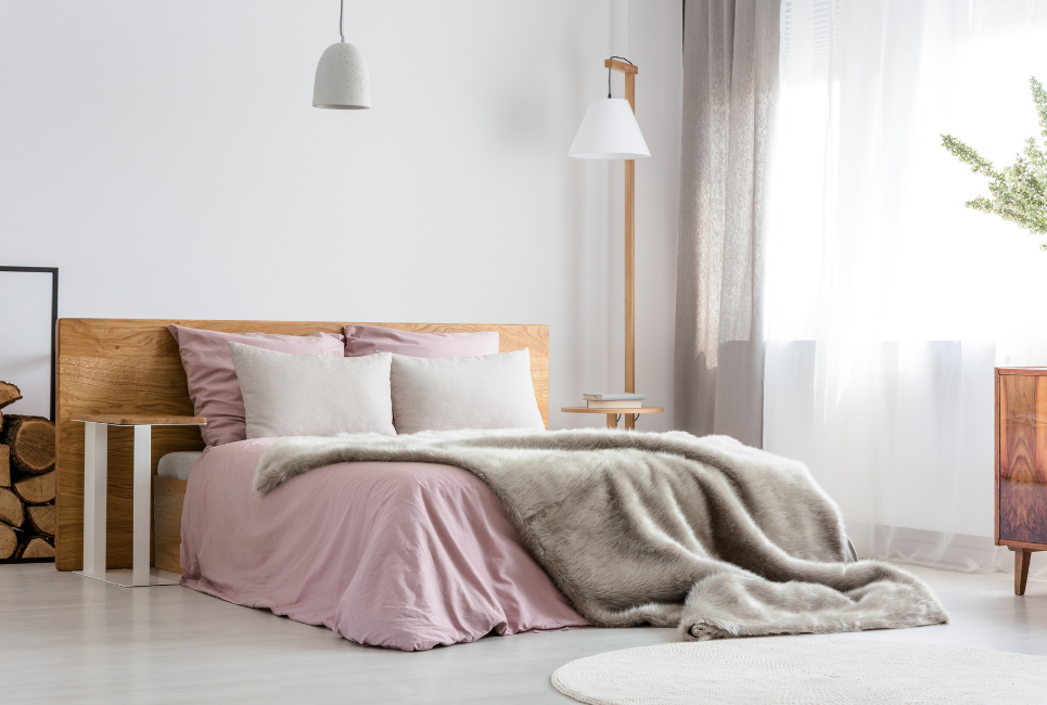 taupe weighted blanket on trendy pink bed