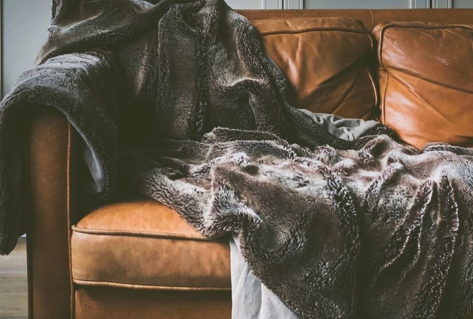 weighted blanket faux fur blanket draped over couch