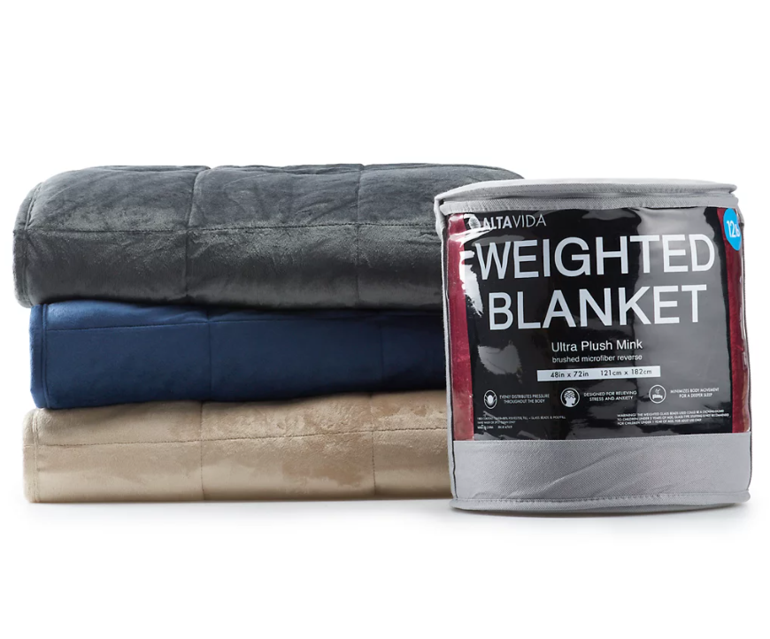 weighted blanket in package with product behind