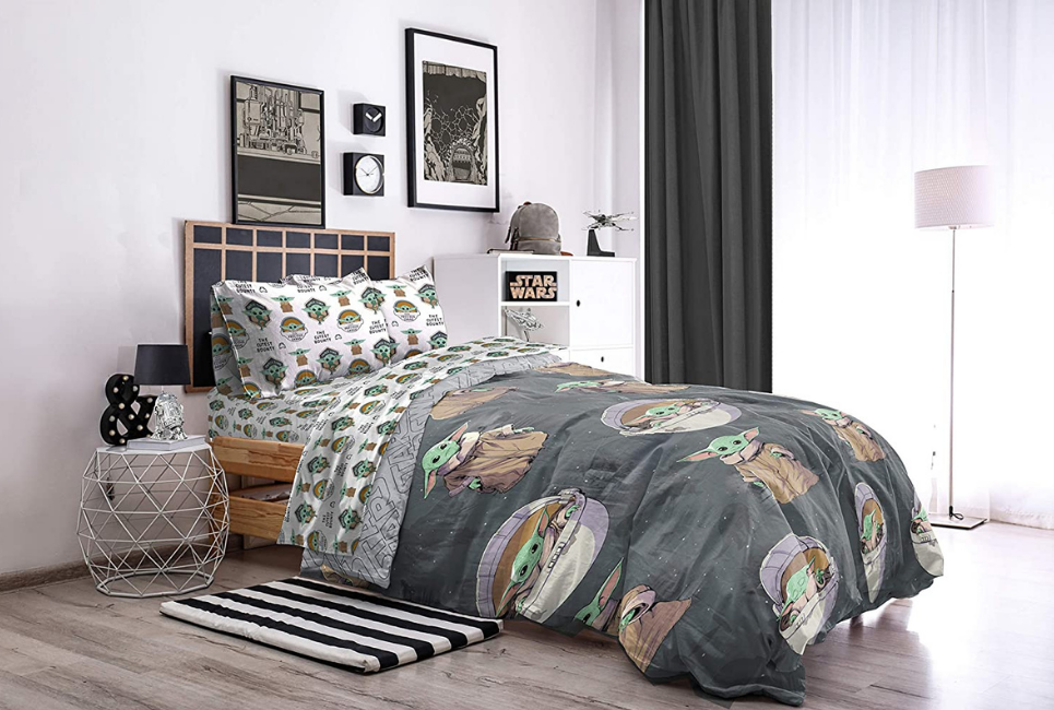 yoda star wars comforter on bed in star wars decorated room