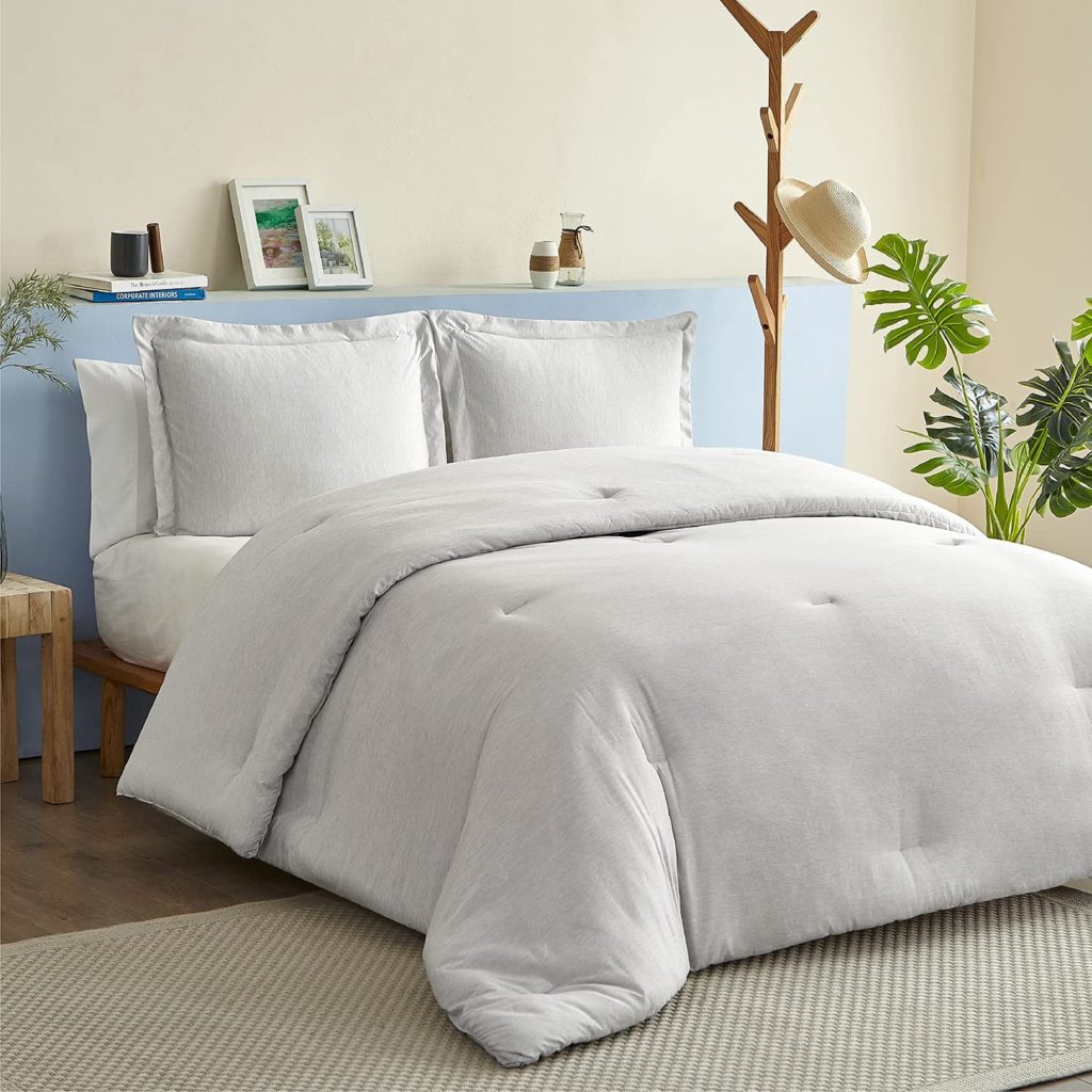 grey neutral bedding set in clean cozy room