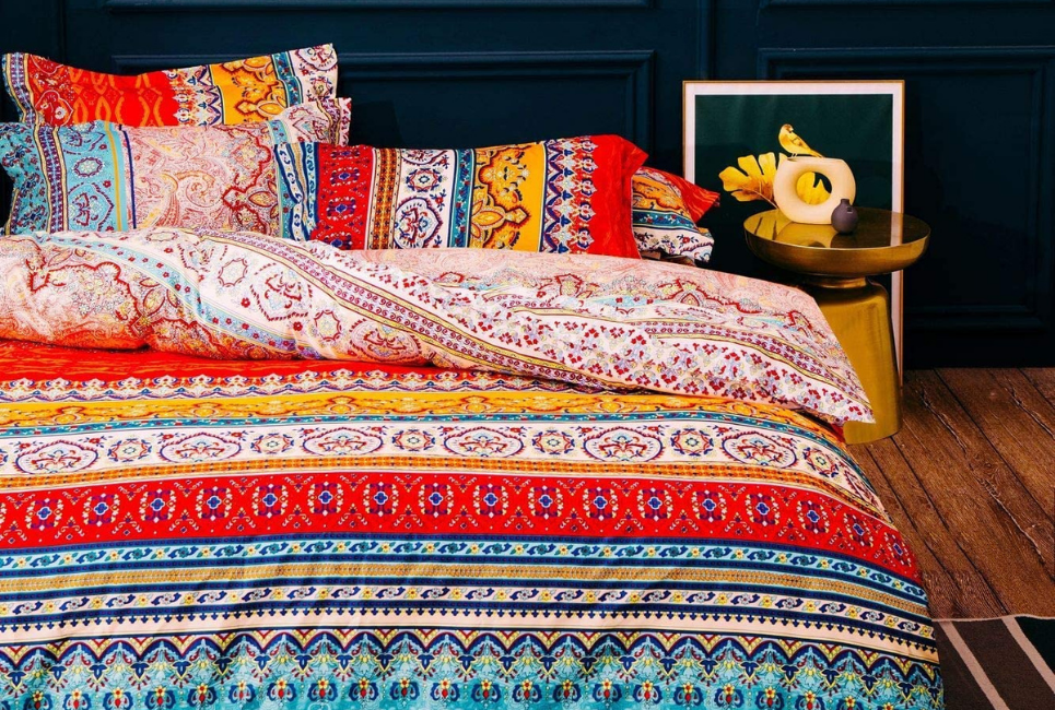 multicolored vibrant boho comforter on bed