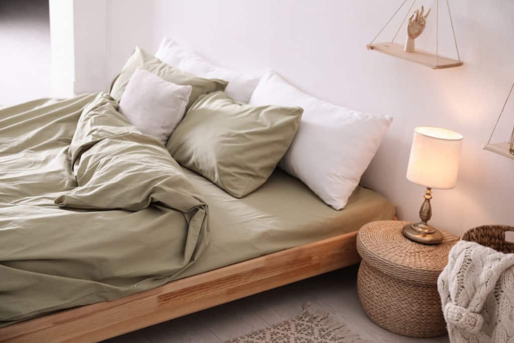 Comfortable Bed with Olive Green Linen