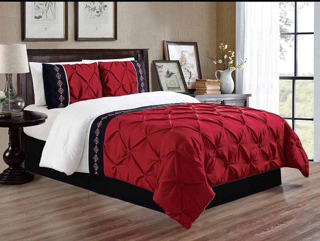 Red and Navy detail comforter on bed