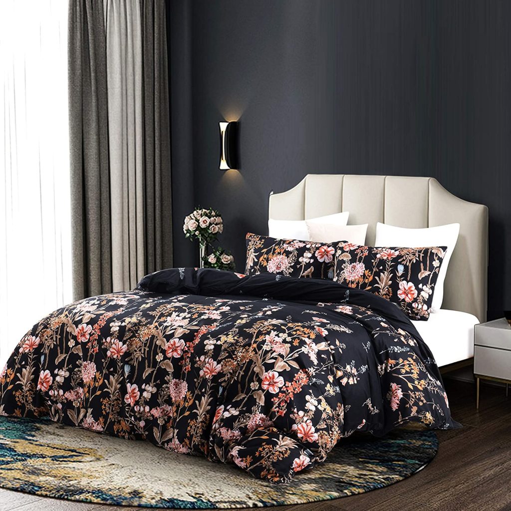 black floral comforter in modern black and white room