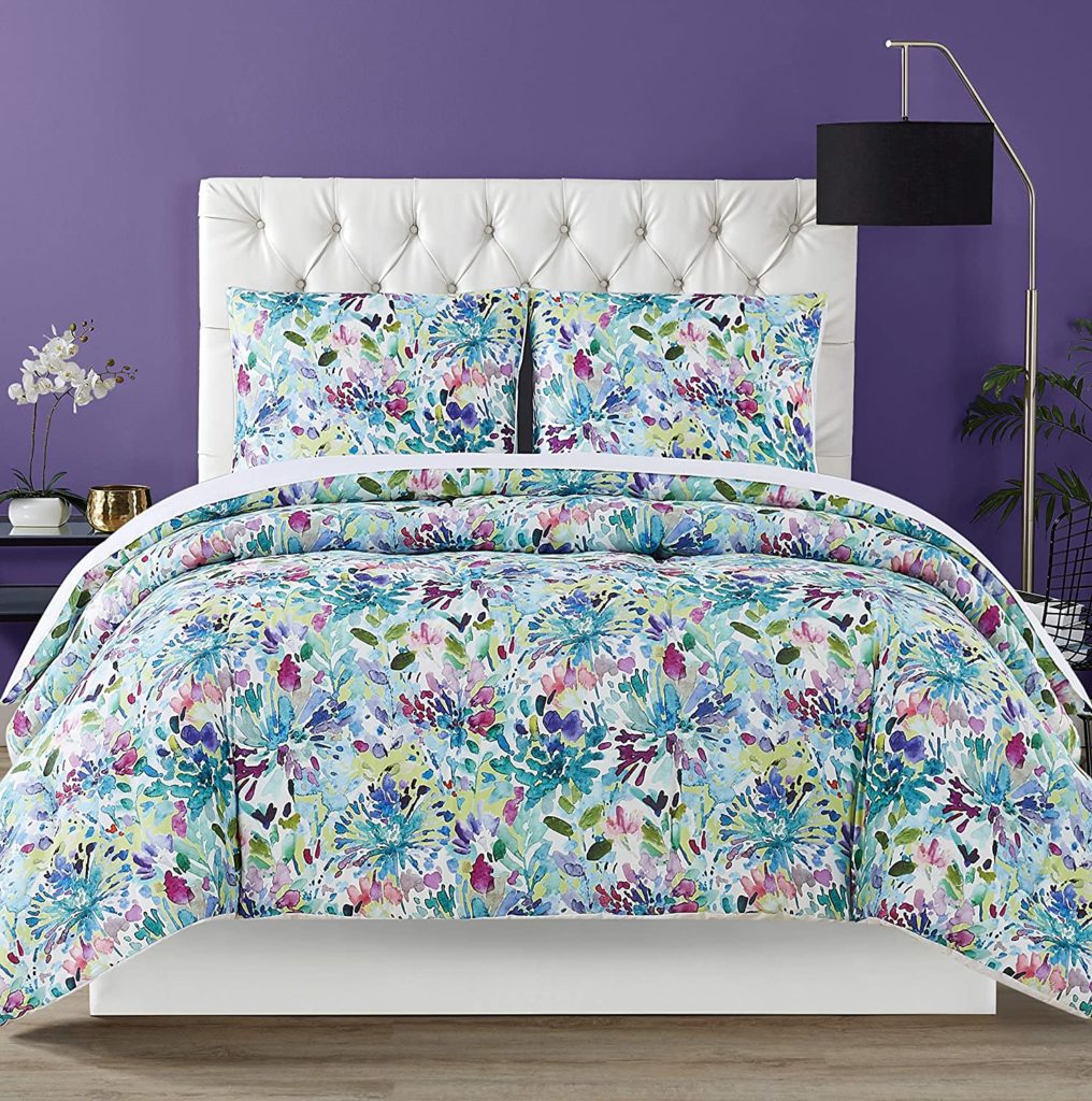Botanical Floral Comforter Set on Bed with purple wall