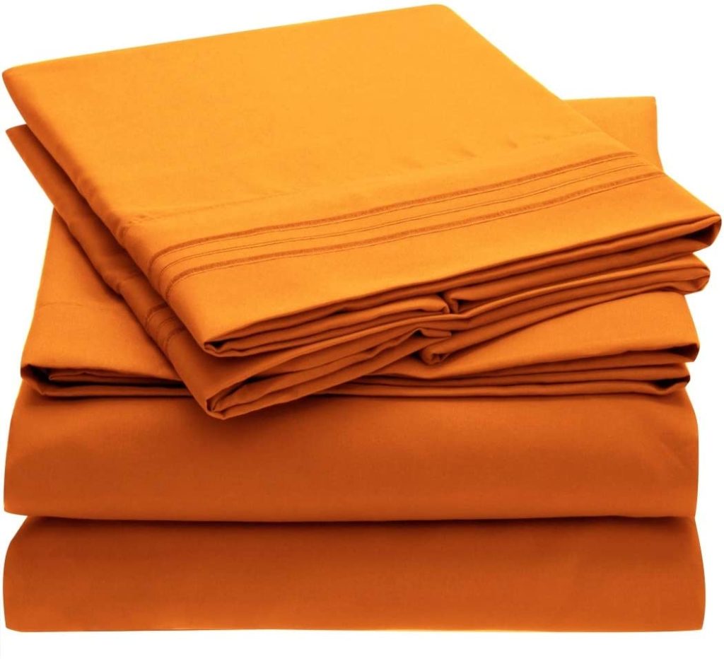neatly folded orange sheet set