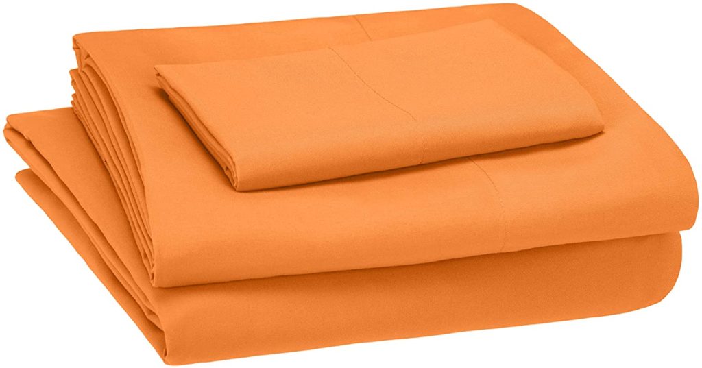 neatly folded orange sheets