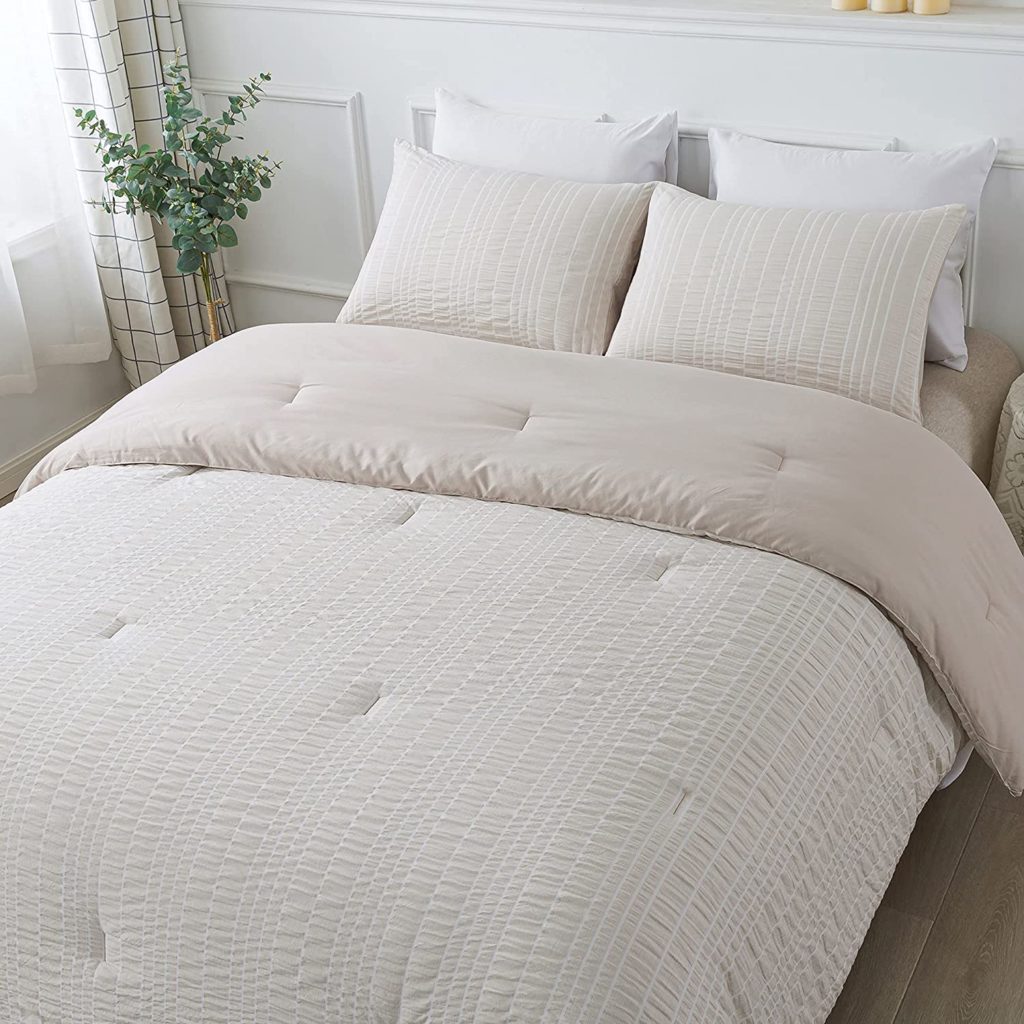 beige seer suckered textured comforter set in clean room