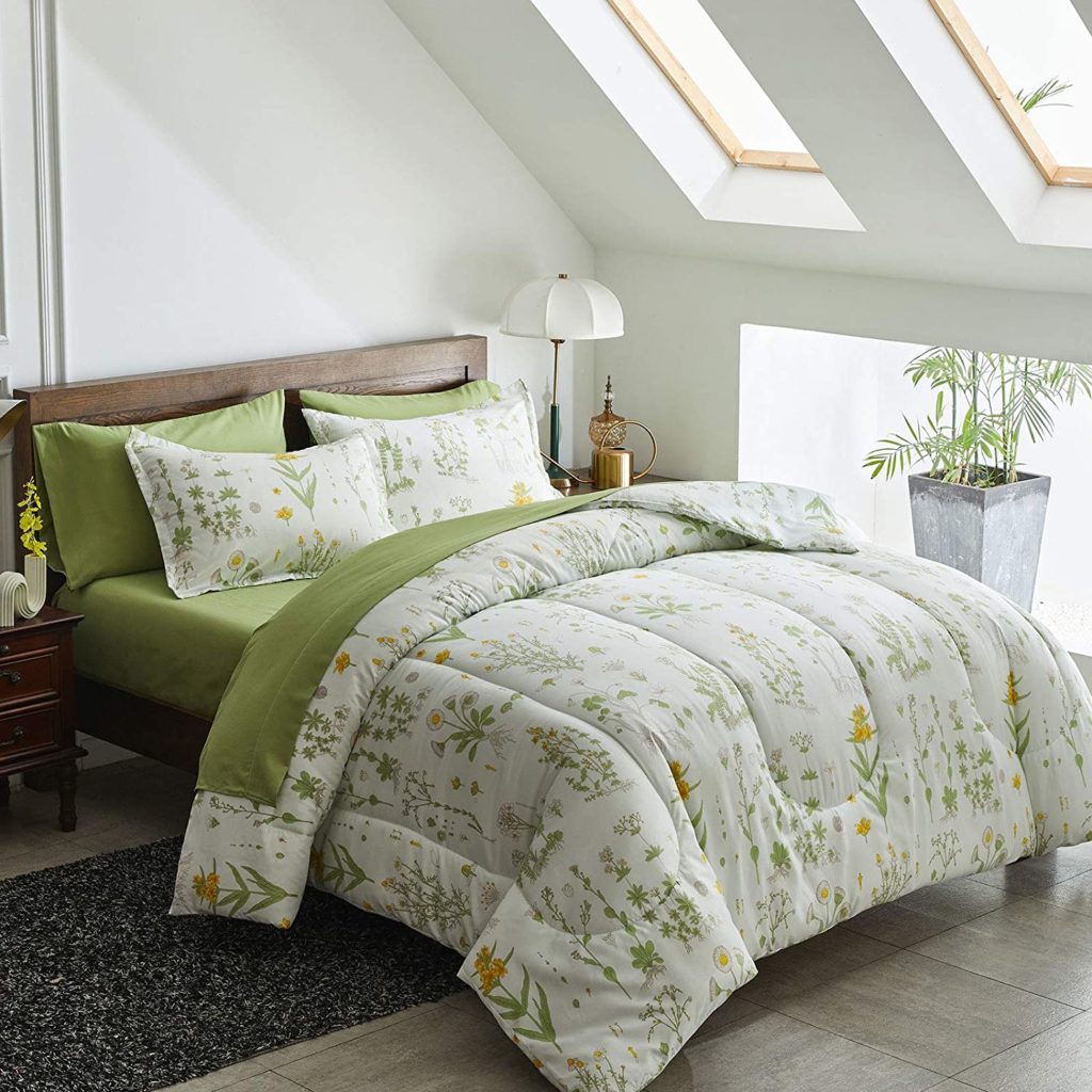 botanical floral print comforter on bed with green sheets