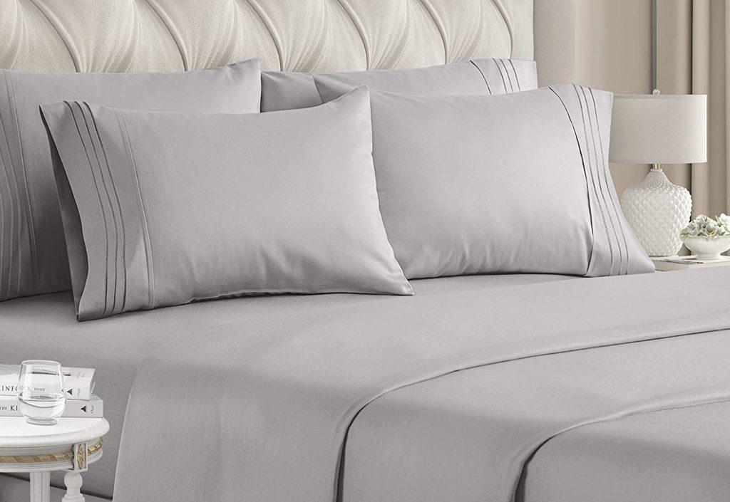 light grey sheets on elegant bed