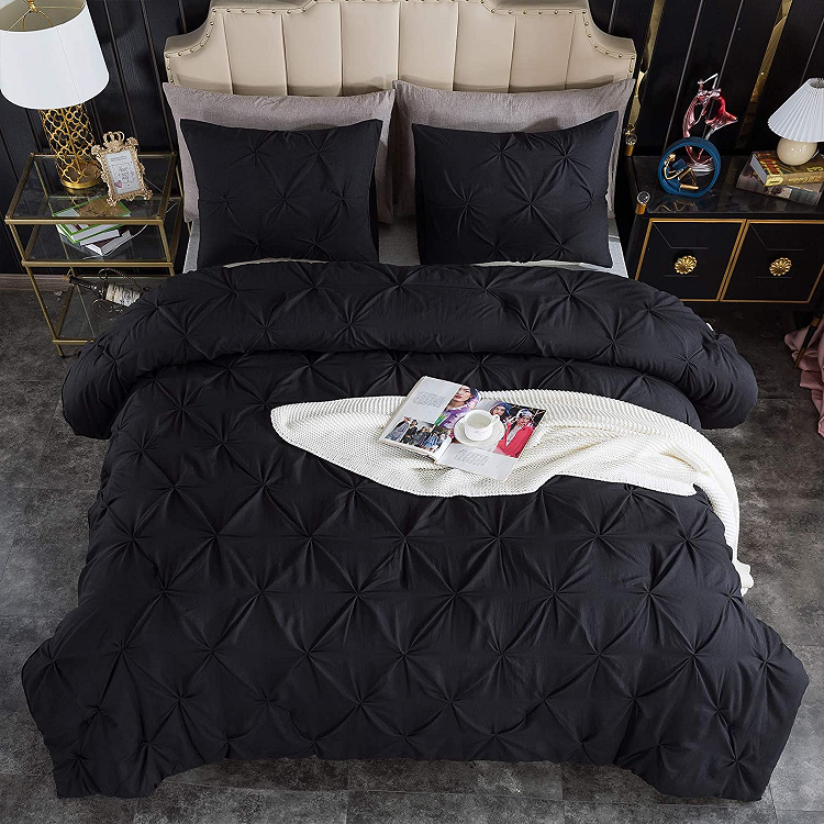 Andency Black Pinch Pleat Comforter in luxurious room