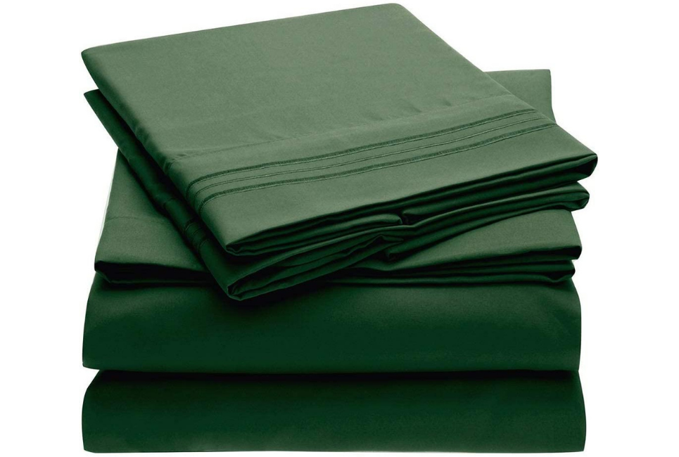 emerald green sheet set folded neatly