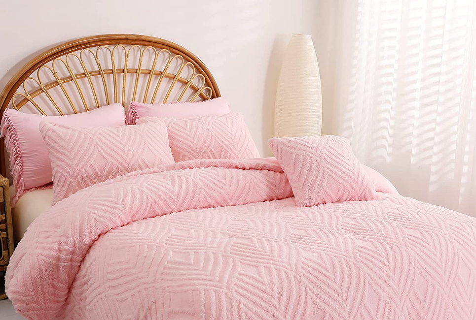 Pink Textured Bedding Set Styled in bed with cane headboard