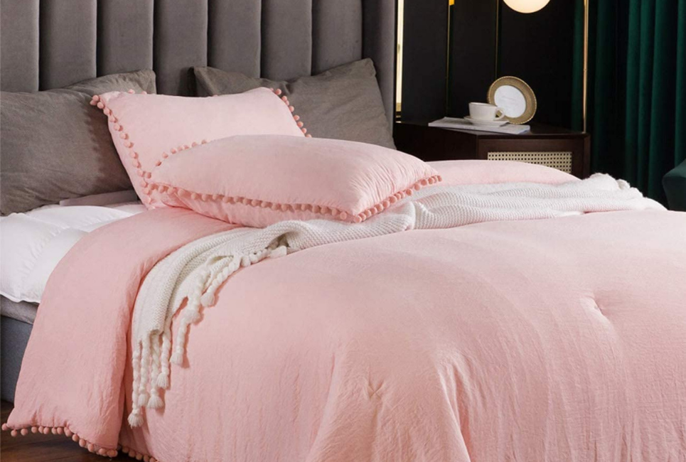 Pink Comforter bedding set with pom pom detail