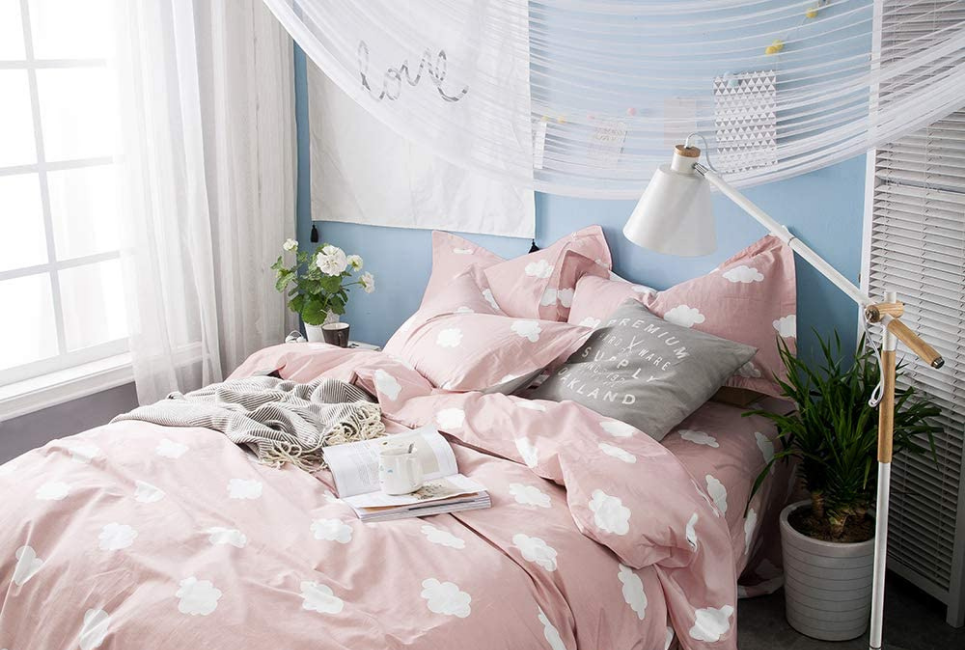 Pink Comforter with Cloud pattern styled in trendy bedroom