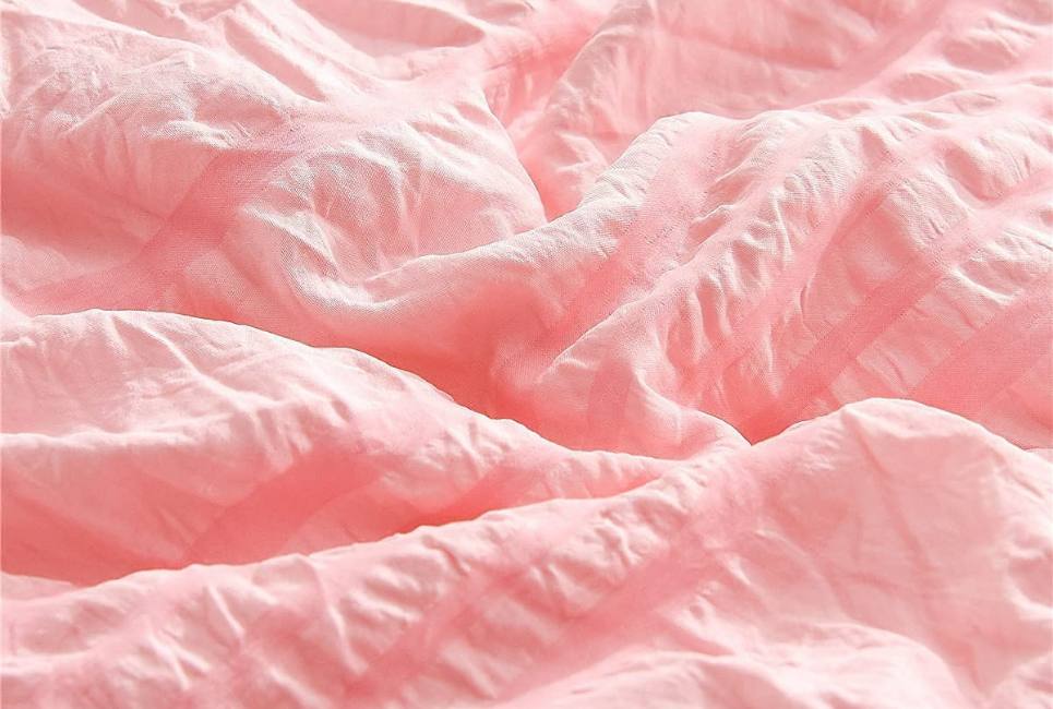 Close up of pink textured bedding