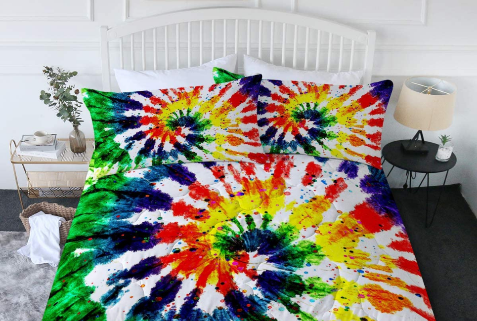 primary color tie-dyed comforter and pillow shams on bed