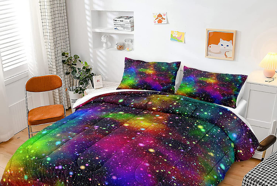 galaxy multicolored comforter set on bed