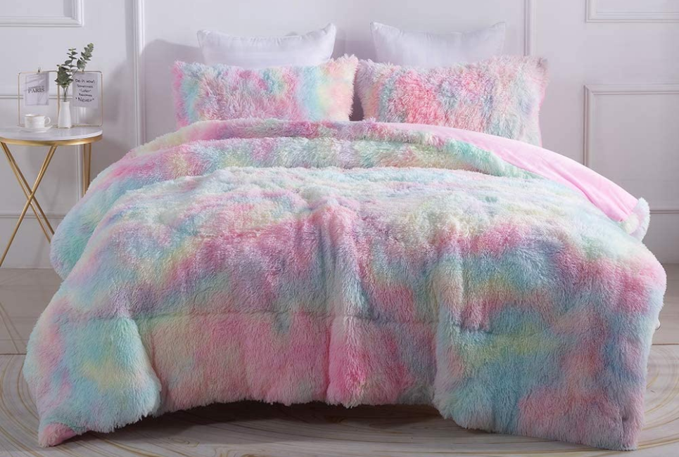 plush fuzzy pastel tie-dye rainbow comforter on bed