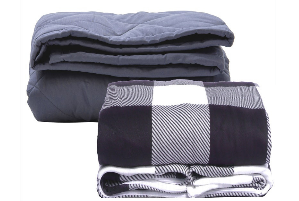 neatly folded dark grey blanket and navy and white plaid blanket