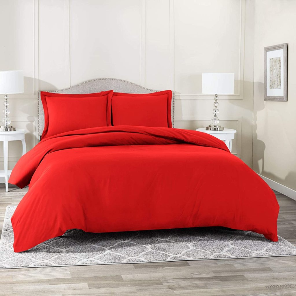 Bright Red Comforter on bed in clean cozy room