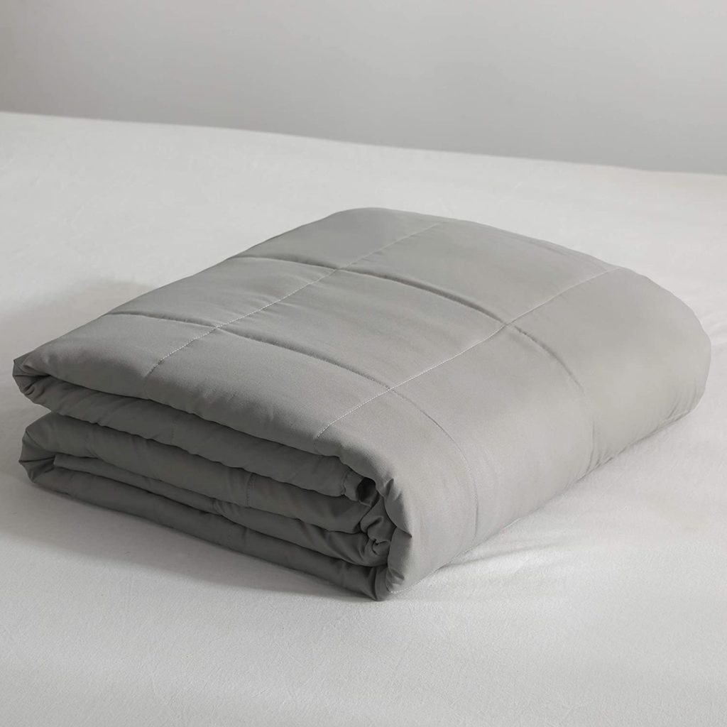 neatly folded grey blanket