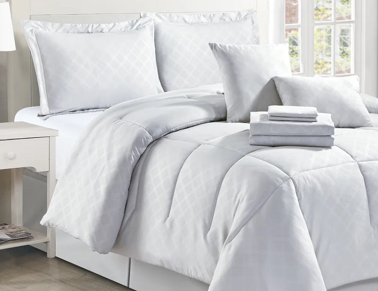 White Patterned Bedding set on neatly made bed