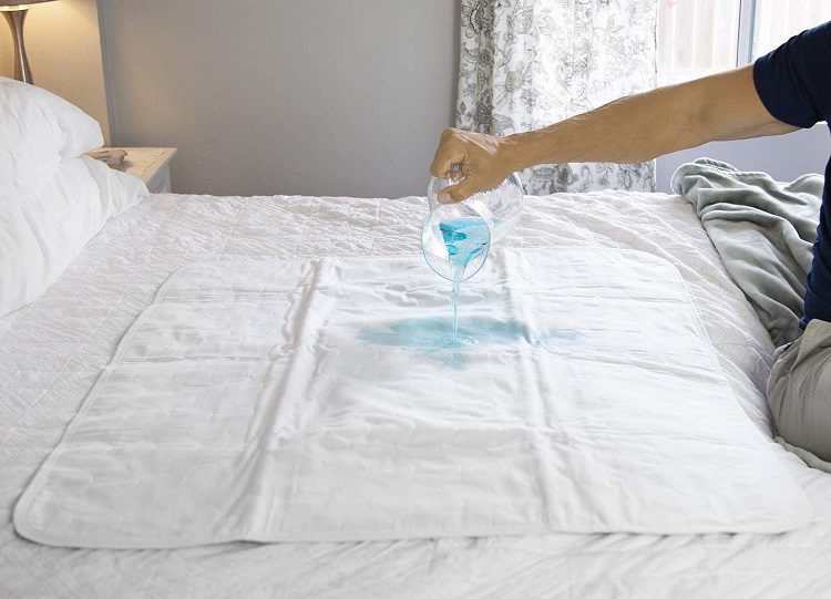 pouring liquid on latex bed cover