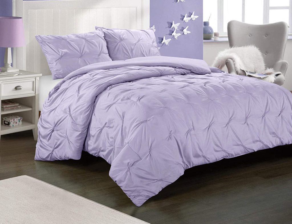 Lavender comforters on neatly made bed