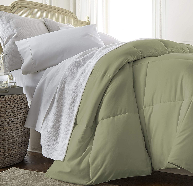 Linen Market Comforter in Olive on unmade bed