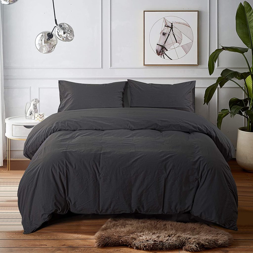 Washed dark grey comfoter set on bed in cozy room