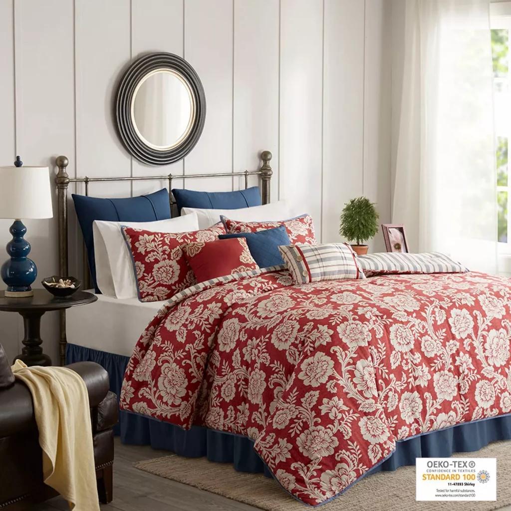 Floral Pattern red and blue comforter on bed
