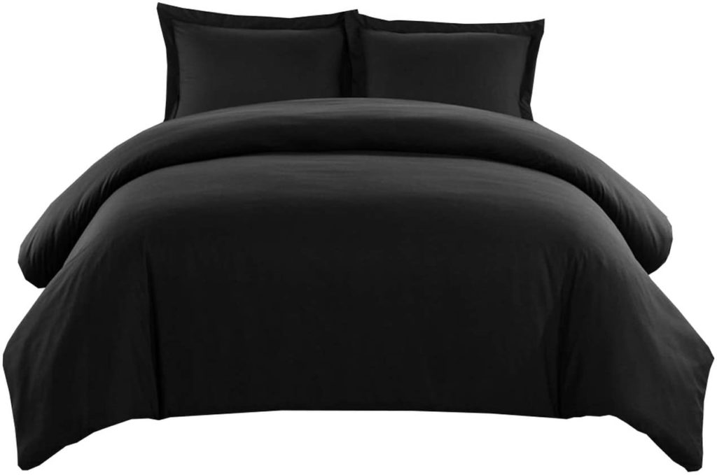 Black comforter set on bed