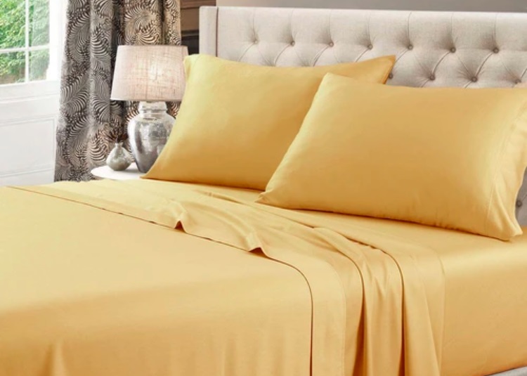 Royal Tradition Solid Waterbed Sheet Set in Marigold Yellow Color on Bed