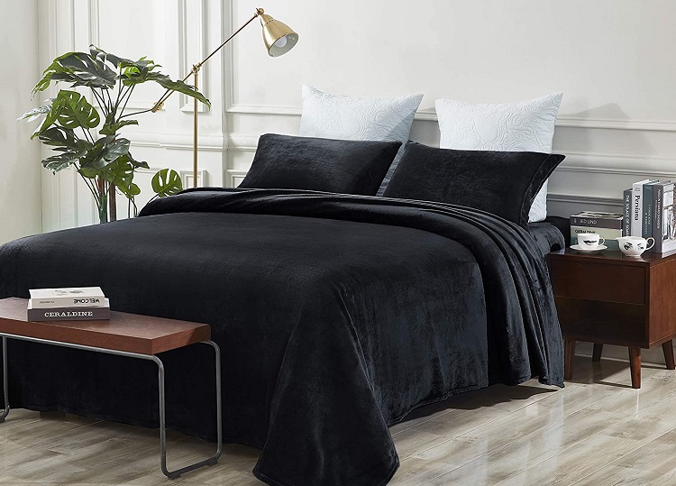 black fleece sheets on bed in trendy elegant room
