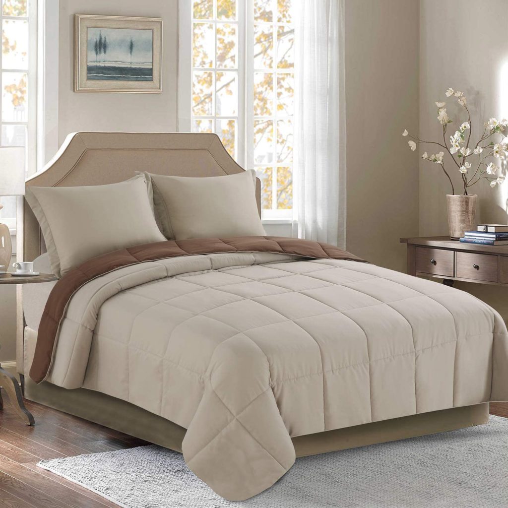 brown and beige reversible comforter on bed