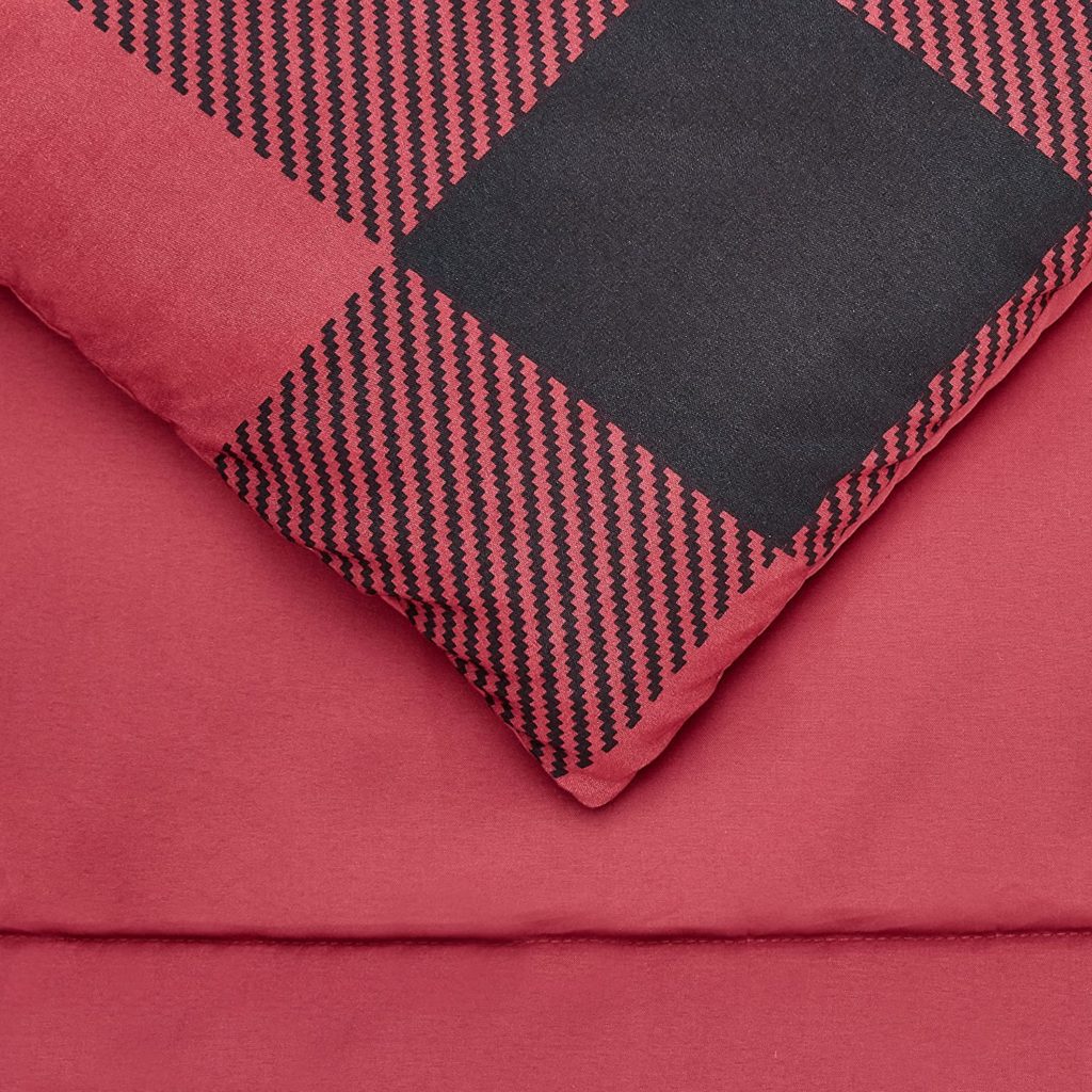 close up of corner of red and black checkered bedding