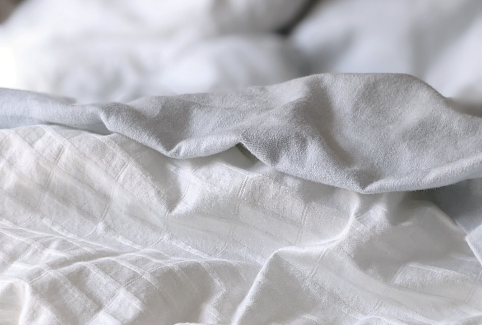 close up of textured white sheets