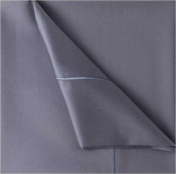 corner of steel blue sheets with piping detail